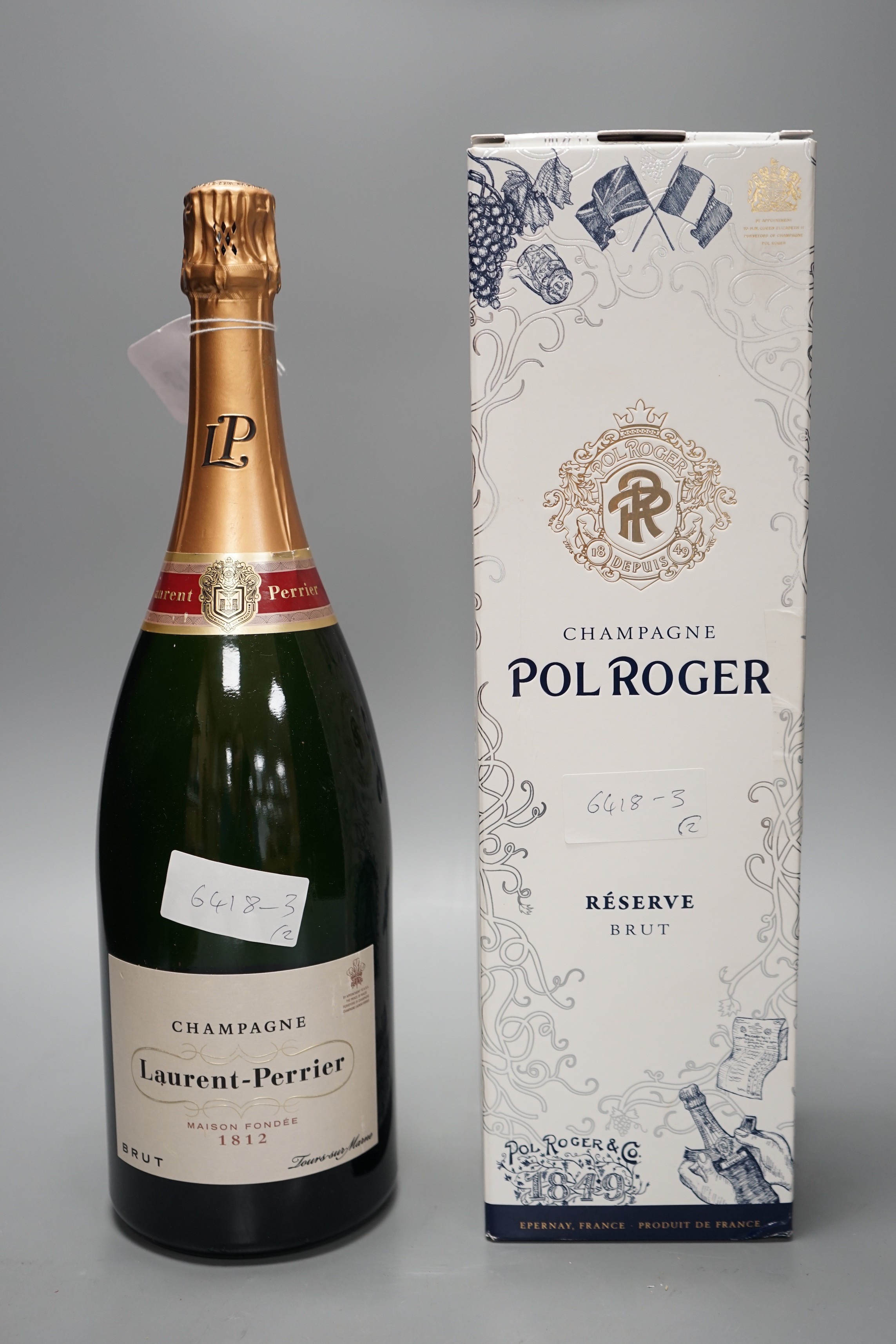 One boxed magnum of Pol Roger NV champagne and one magnum bottle of Laurent Perrier NV champagne